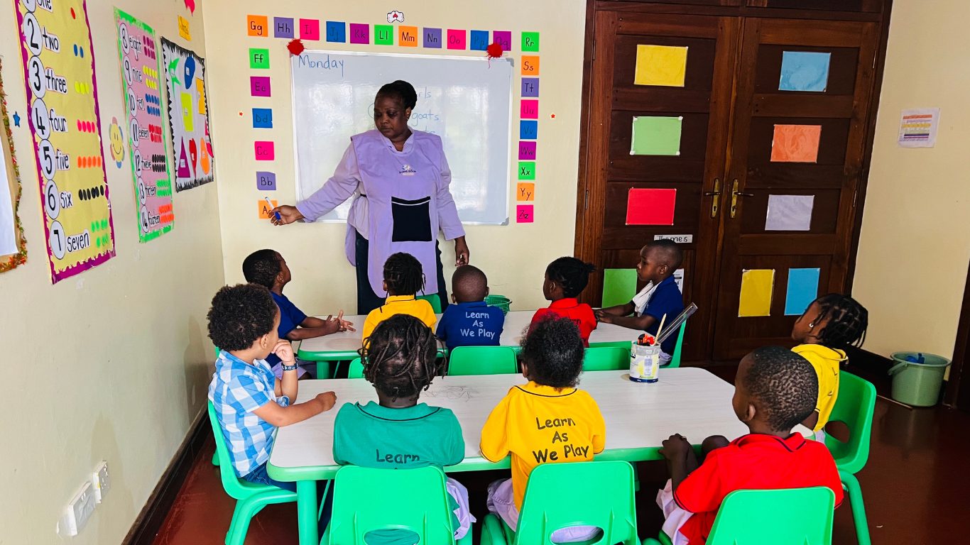 Nursery children at a Montessori activity table